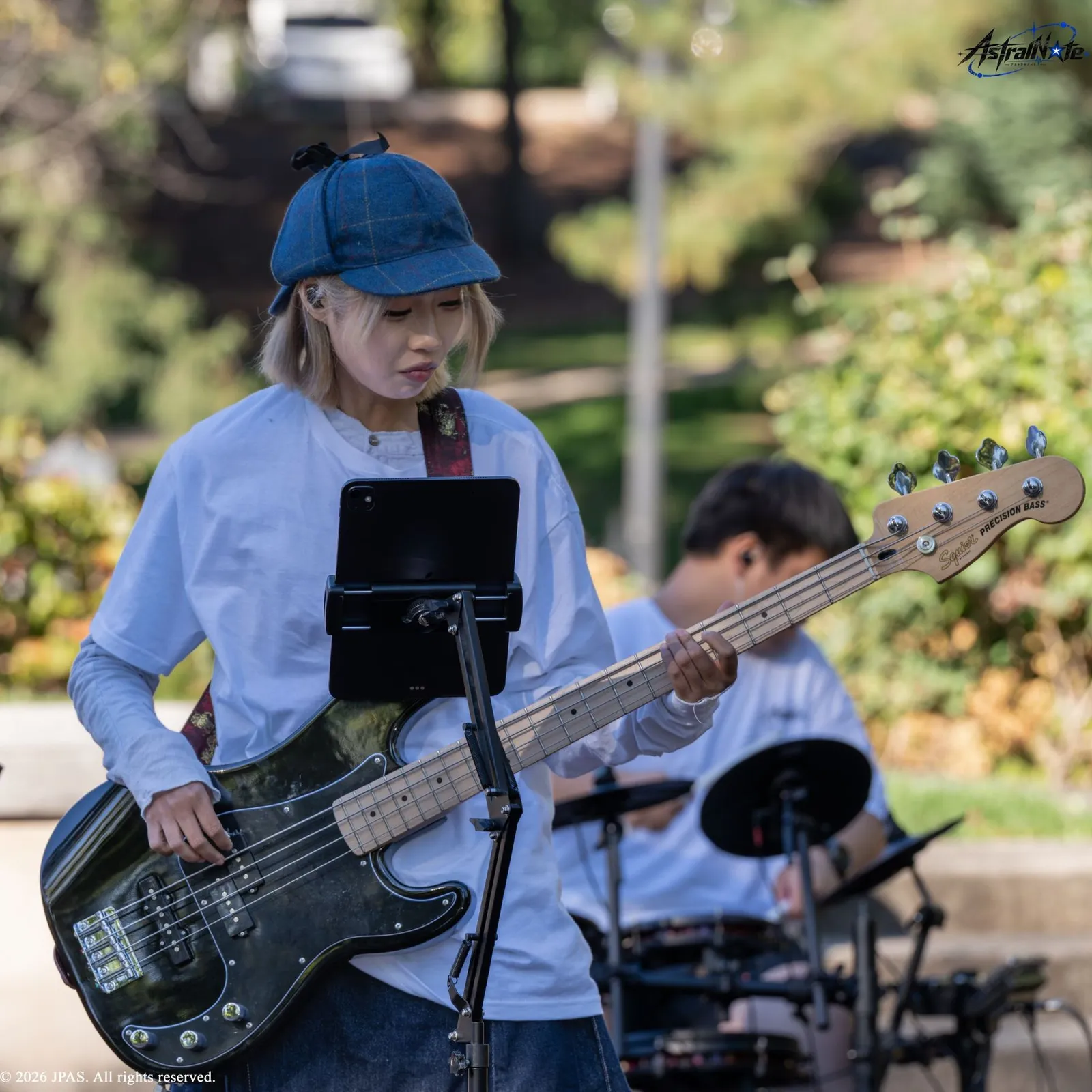 A musician plays bass guitar at Astral Note 0th LIVE.