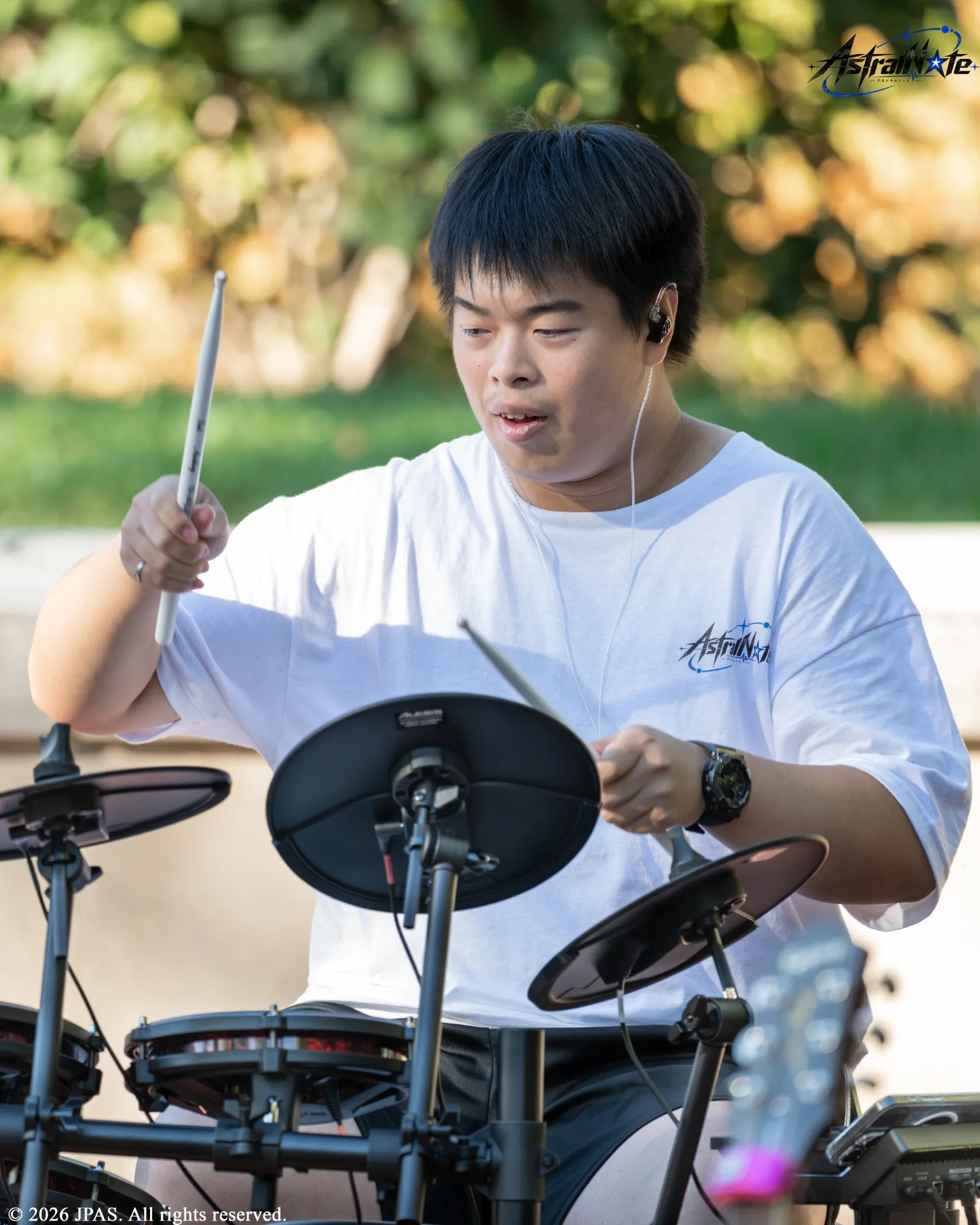 A musician plays an electronic drum kit at Astral Note 0th LIVE.