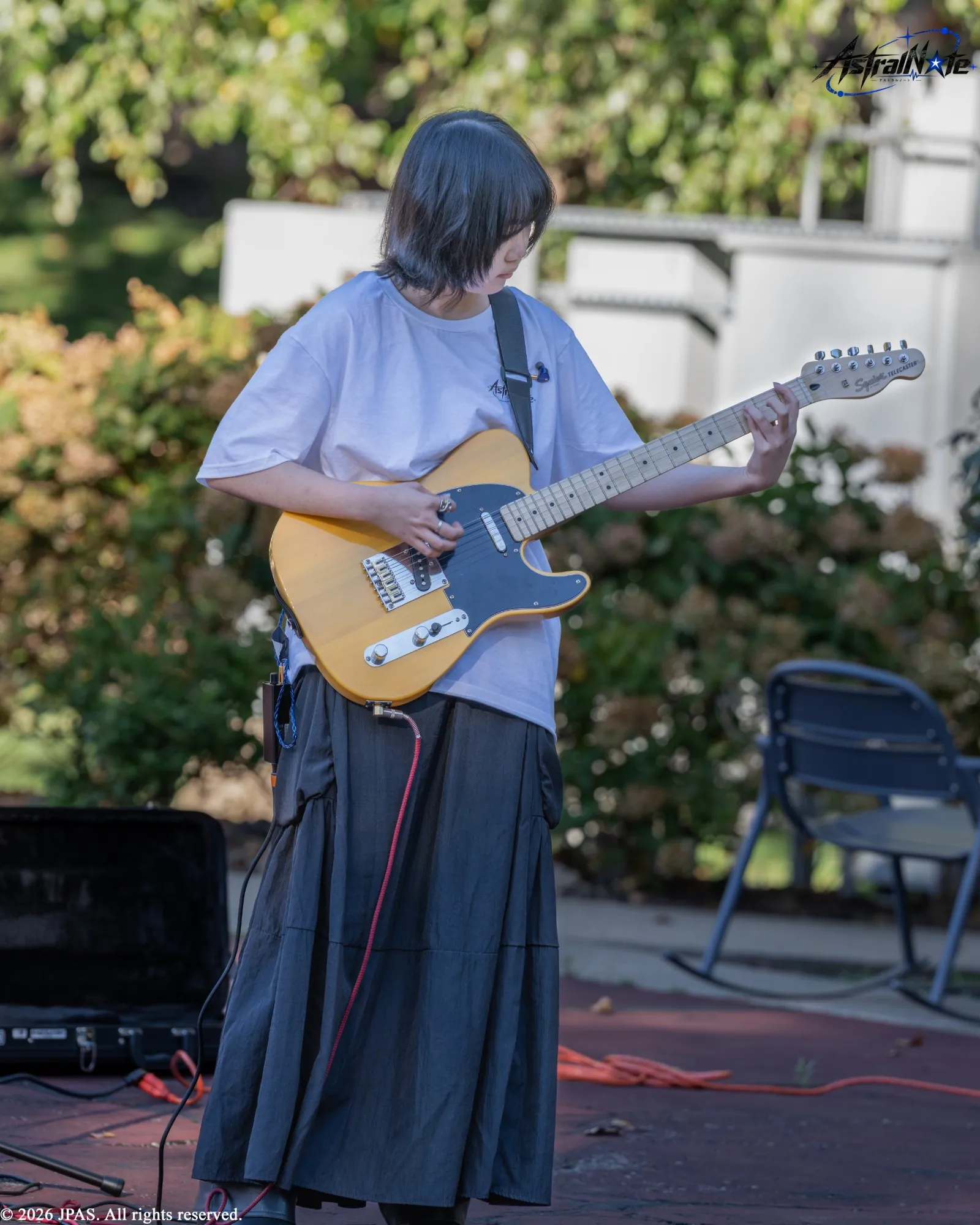 A musician plays electric guitar at Astral Note 0th LIVE.